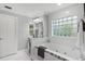 Spacious bathroom with a large soaking tub and a separate vanity area at 39112 Treeline Dr, Lady Lake, FL 32159