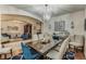 Open concept dining room showcasing a wood table and access to living areas at 349 Morning View Dr, Winter Garden, FL 34787