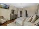Spacious bedroom with large bed, dresser, and comfortable armchair at 349 Morning View Dr, Winter Garden, FL 34787