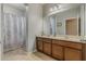 Double vanity bathroom with shower and tile floors at 349 Morning View Dr, Winter Garden, FL 34787