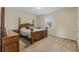 Spacious bedroom with wood furniture and carpeted floors at 349 Morning View Dr, Winter Garden, FL 34787