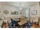 Bright dining room with a large table, chandelier, and decorative rug at 349 Morning View Dr, Winter Garden, FL 34787
