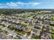 Aerial view of a residential neighborhood with houses and lush greenery at 349 Morning View Dr, Winter Garden, FL 34787