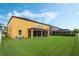 Large backyard with home and solar panels at 349 Morning View Dr, Winter Garden, FL 34787