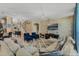 Spacious living room with sectional sofa and stone accent wall at 349 Morning View Dr, Winter Garden, FL 34787