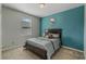 Bedroom with teal accent wall and double bed at 349 Morning View Dr, Winter Garden, FL 34787