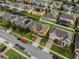 Aerial view of Johns Lake Pointe community, showcasing homes, landscaping, and a street at 349 Morning View Dr, Winter Garden, FL 34787