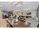 Open concept kitchen and dining area with modern island at 349 Morning View Dr, Winter Garden, FL 34787