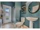 Small bathroom with pedestal sink, toilet, and shower at 349 Morning View Dr, Winter Garden, FL 34787