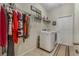 Laundry room with washer, dryer, and hanging racks at 349 Morning View Dr, Winter Garden, FL 34787