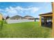 Green grassy backyard with white fence at 349 Morning View Dr, Winter Garden, FL 34787