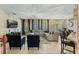 Open living space with sectional sofa and stone fireplace at 349 Morning View Dr, Winter Garden, FL 34787