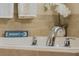 Close-up of a bathtub faucet in a relaxing bathroom setting at 349 Morning View Dr, Winter Garden, FL 34787