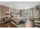 Main bedroom with large bed, plush bedding and hardwood floors at 349 Morning View Dr, Winter Garden, FL 34787
