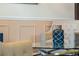 Blue glass vase with rope decor sits on a glass coffee table at 349 Morning View Dr, Winter Garden, FL 34787