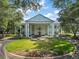 Elegant clubhouse with columns and landscaping, inviting entrance at 3828 Arbordale Ct, Leesburg, FL 34748