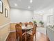 Bright dining room with a round wooden table and chairs at 32857 Timberwood Dr, Leesburg, FL 34748