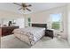Cozy bedroom with ample closet space and ceiling fan at 32857 Timberwood Dr, Leesburg, FL 34748