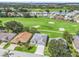 Aerial view showing home's location in golf course community at 32857 Timberwood Dr, Leesburg, FL 34748
