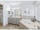 Bathroom with a walk-in shower and updated vanity at 32857 Timberwood Dr, Leesburg, FL 34748