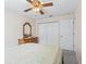 Bedroom with double closets and ceiling fan at 32857 Timberwood Dr, Leesburg, FL 34748