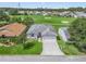 Aerial view of home with driveway and landscaping at 32857 Timberwood Dr, Leesburg, FL 34748