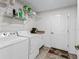 Laundry room with washer, dryer, and shelving at 32857 Timberwood Dr, Leesburg, FL 34748