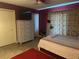 Bedroom with a double bed, white dresser, and red carpet at 192 Villa City Rd, Groveland, FL 34736