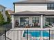 Inviting pool area with patio furniture and modern fence at 16820 Bolsena Dr, Bella Collina, FL 34756
