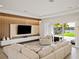 Spacious living area with access to backyard patio and lake views at 16820 Bolsena Dr, Bella Collina, FL 34756