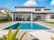 Inviting swimming pool with spacious patio and modern design at 16820 Bolsena Dr, Bella Collina, FL 34756