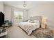Main bedroom with king-size bed and stylish decor at 16820 Bolsena Dr, Bella Collina, FL 34756