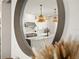 Reflective view of a bright kitchen with white cabinets and marble countertops at 16820 Bolsena Dr, Bella Collina, FL 34756