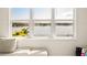 Stunning lake view from a bright and airy room with a comfy couch at 16820 Bolsena Dr, Bella Collina, FL 34756