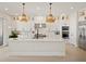 Modern kitchen boasting a center island and high-end finishes at 16820 Bolsena Dr, Bella Collina, FL 34756