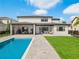 Luxury home with pool, patio, and covered outdoor dining area at 16820 Bolsena Dr, Bella Collina, FL 34756