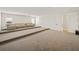 Spacious home theater with tiered seating and neutral carpeting at 16820 Bolsena Dr, Bella Collina, FL 34756