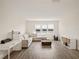 Relaxing bonus room with a sectional sofa and lake view at 16820 Bolsena Dr, Bella Collina, FL 34756