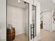 Glass-enclosed wine cellar with barrel and ample storage at 16820 Bolsena Dr, Bella Collina, FL 34756