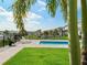 Private pool with grassy area and lake view at 16820 Bolsena Dr, Bella Collina, FL 34756