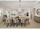 Modern kitchen with white cabinets, stainless steel appliances, and an island at 16820 Bolsena Dr, Bella Collina, FL 34756