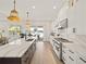 Modern kitchen with island, water views, and high-end finishes at 16820 Bolsena Dr, Bella Collina, FL 34756