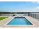Stunning pool with lake view and lounge chairs at 16820 Bolsena Dr, Bella Collina, FL 34756