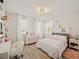 Charming bedroom with a double bed, desk, and stylish decor at 16820 Bolsena Dr, Bella Collina, FL 34756