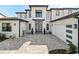Modern two-story home with gray brick exterior at 16820 Bolsena Dr, Bella Collina, FL 34756