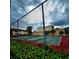 Community tennis court with chain link fence at 6116 Curry Ford Rd # 229, Orlando, FL 32822