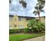 Exterior view of a condo building with landscaping at 6116 Curry Ford Rd # 229, Orlando, FL 32822