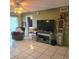 Living room with TV, furniture, and access to other rooms at 6116 Curry Ford Rd # 229, Orlando, FL 32822