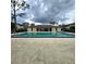 Community pool with covered seating area at 6116 Curry Ford Rd # 229, Orlando, FL 32822