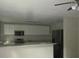 Updated kitchen with stainless steel appliances and granite countertops at 214 W Dade Ave, Bushnell, FL 33513